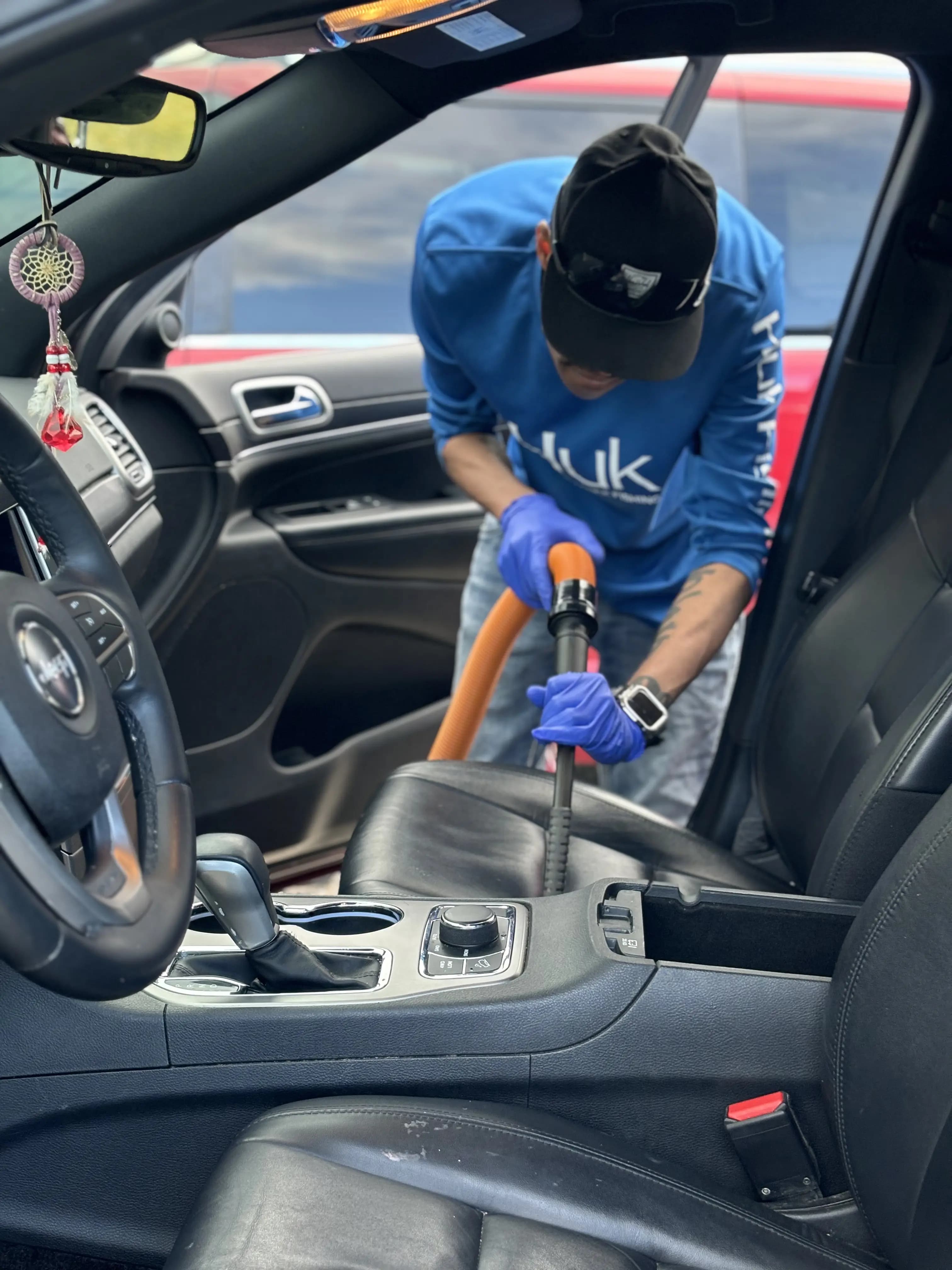 Vacuuming the interior of a car